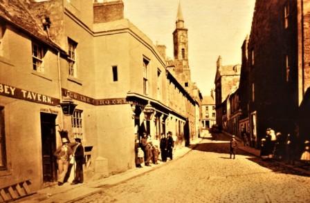 Photo of Kirkgate Street, Dunfermline circa 1870-5. The Post Office was situated on the west side of the street, opposite the entrance to Maygate