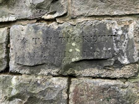 Photo of the stone on Rumbling Bridge showing initials and masons' marks. Photo by Davy Guild
