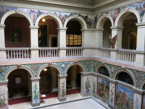 Photo of the central hall with murals