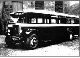 Photo of C. 1920 An early Jackson bodied bus outside the Mill St premises