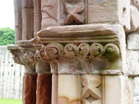 Photo of Stone carving on the doorway to the Abbey from the cloister
