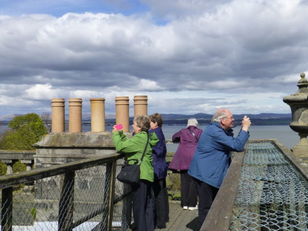 Society members taking the views from the roof platform