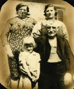 Thomas Pollock, with his daughter, grand-daughter and great-grand-daughter. Probably taken in 1939 or 1940, outside the house in Kingseat. Thanks to John Flynn, Thomas' great grand-son for the photo.